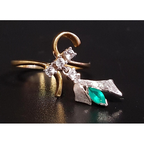 101 - UNUSUAL EMERALD AND WHITE SAPPHIRE DRESS RING
the shaped setting with three small white sapphires an... 
