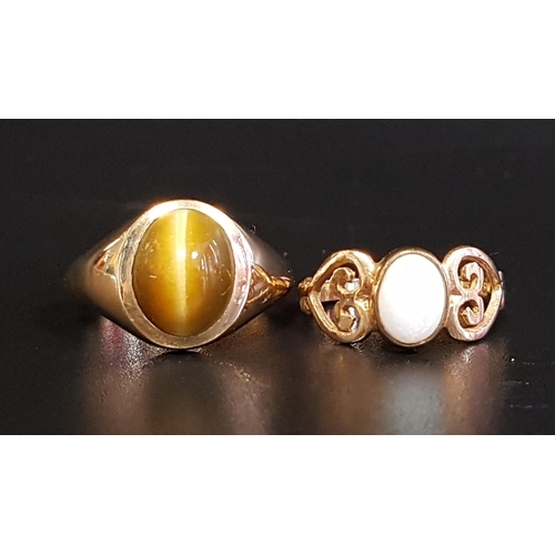 118 - TWO GEM SET NINE CARAT GOLD RINGS
comprising an oval cabochon opal ring with decorative pierced shou... 