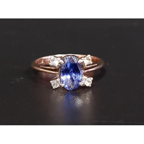 128 - SAPPHIRE AND DIAMOND CLUSTER RING
the central oval cut sapphire with two diamonds set at diagonal co... 