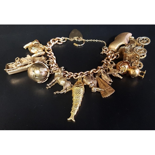 85 - HEAVY NINE CARAT GOLD CHARM BRACELET
with a good selection of twelve gold charms, some larger size, ... 
