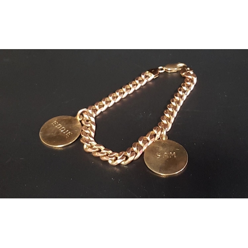103 - NINE CARAT GOLD CURB LINK BRACELET
with two named and dated disc charms, 19.2cm long and approximate... 
