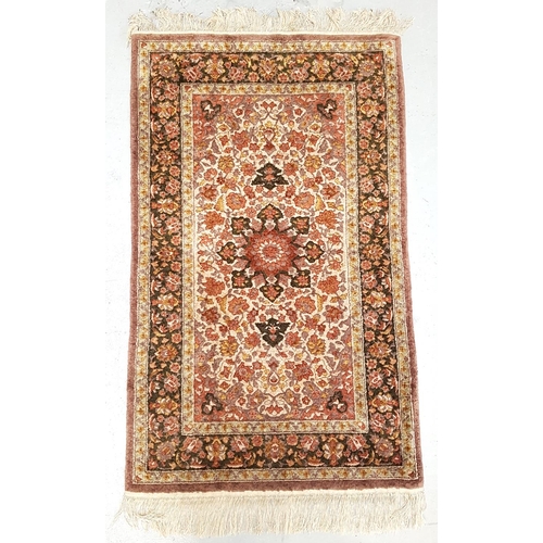 595 - CHINESE RUG
with profuse floral decoration and fringed ends, 152cm long excluding fringe