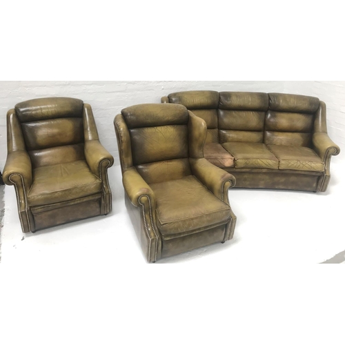 492 - LEATHER THREE PIECE SUITE
comprising a curved three seat sofa, wing armchair and an armchair, all wi... 