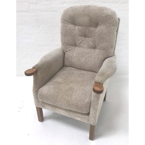 493 - UPHOLSTRED ARMCHAIR
with a button back above shaped arms and a stuffover seat, standing on plain sup... 