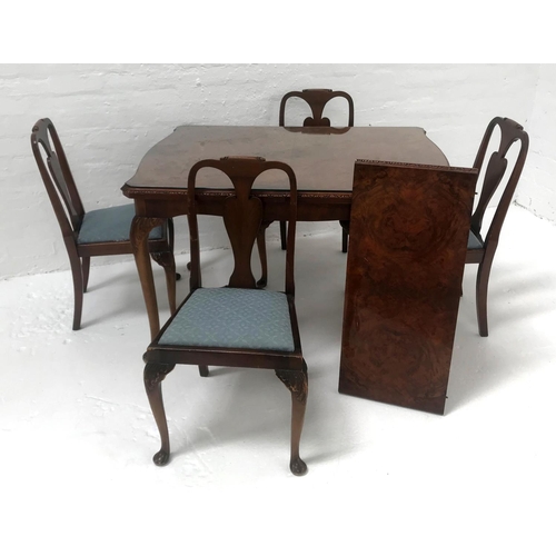 497 - WALNUT DINING TABLE AND FOUR CHAIRS
the table with a figured walnut shaped pull apart top and extra ... 