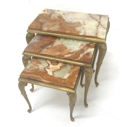 543 - NEST OF ALABASTER OCCASIONAL TABLES
on gilt metal bases with cabriole supports, 44.5cm high