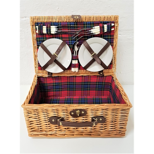 369 - WICKER PICNIC HAMPER
with a tartan lined interior and four place settings, comprising plates and cut... 