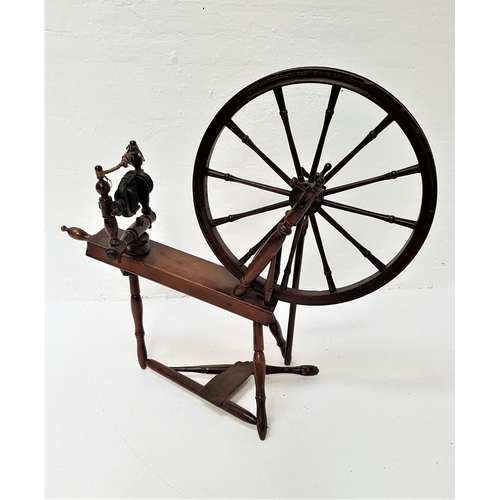 597 - STAINED PINE SPINNING WHEEL
with treadle operation