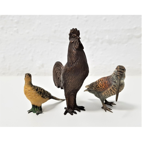 373 - TWO COLD PAINTED BRONZE BIRDS
comprising a Curlew, 6cm high and a hen pheasant, 5cm high; together w... 