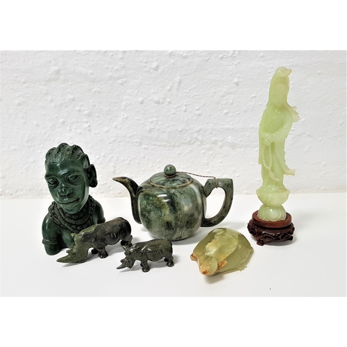 376 - SELECTION OF CARVED JADE COLOURED STONE ORNAMENTS
including a teapot and cover, two rhinos, an Afric... 