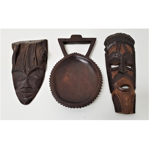 380 - SELECTION OF AFRICAN CARVED HARDWOOD ITEMS
including a carved shallow bowl with handle, 30.5cm long;... 