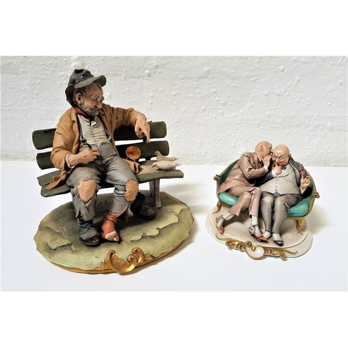 267 - TWO CAPODIMONTE PORCELAIN FIGURINES
one depicting a hobo sat on a bench with doves around him, 22.5c... 