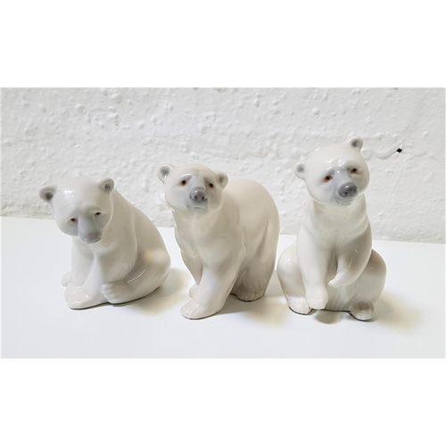 269 - THREE LLADRO PORCELAIN FIGURINES OF POLAR BEARS
two seated, 9cm and 12cm high, and the other on all ... 