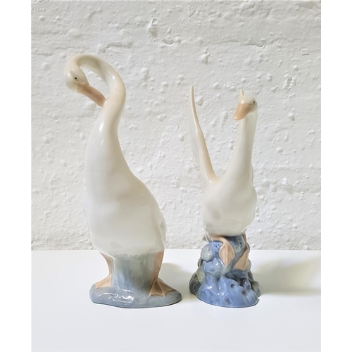 270 - TWO NAO PORCELAIN FIGURINES OF GEESE
one preening itself, 23cm high, the other about to take off, 20... 