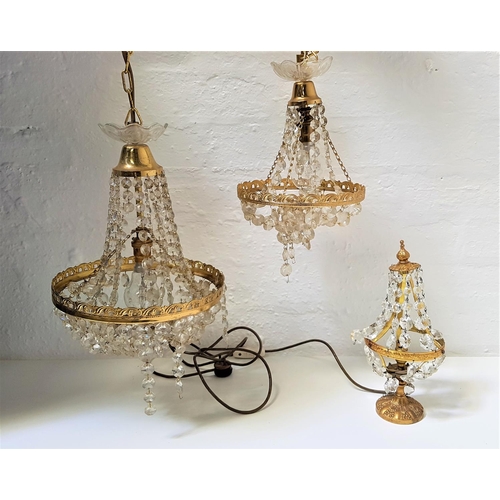 520 - PAIR OF ORNATE CRYSTAL AND GILT METAL PENDANT LIGHTS
with suspension chains and a central gilt metal... 