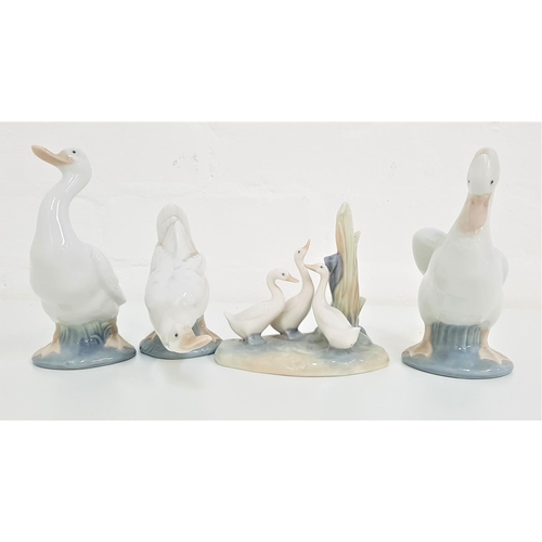 174 - THREE NAO GEESE FIGURINES
14.5cm, 15cm and 11cm high, and a Nao group of three geese, 11.5cm high (4... 