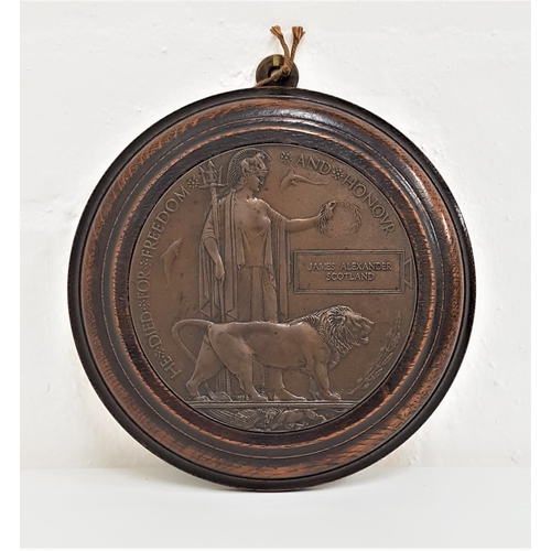 308 - WWI MEMORIAL DEATH PLAQUE
in bronze and an oak frame, named to James Alexander Scotland