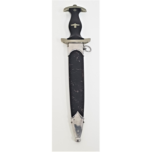 314 - GERMAN WWII SS OFFICERS DRESS DAGGER
with a black ebony handle inset with the enamel SS runes and ea... 