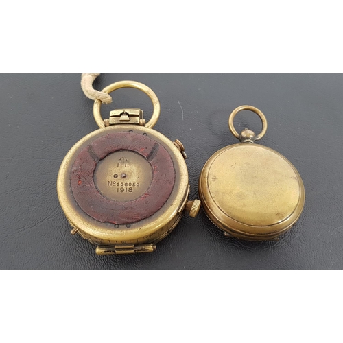 311 - WWI MILITARY MARCHING COMPASS
in brass and marked F-L No;126052 1918, together with a brass pocket w... 