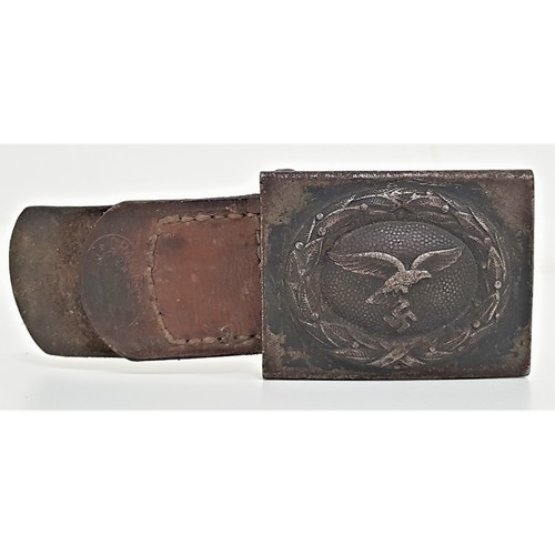 316 - GERMAN WWII LUFTWAFFE BELT BUCKLE
with a flying eagle and swastika, with leather toggle