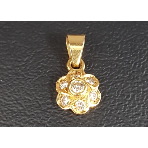 8 - DIAMOND SET FLOWER HEAD DESIGN PENDANT
the seven diamonds totaling approximately 0.25cts, in eightee... 