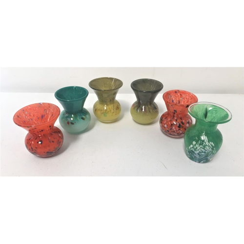 222 - SIX SMALL COLOURFUL GLASS VASES
one Sark glass example, all with mottled decoration and approximatel... 