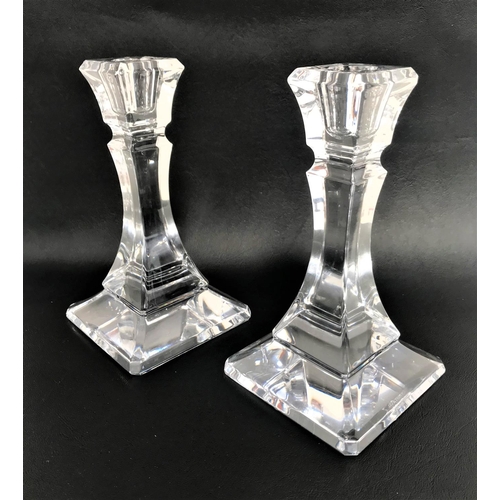 224 - PAIR OF TIFFANY AND GO. CRYSTAL GLASS CANDLESTICKS
raised on tapering square bases, 18cm high