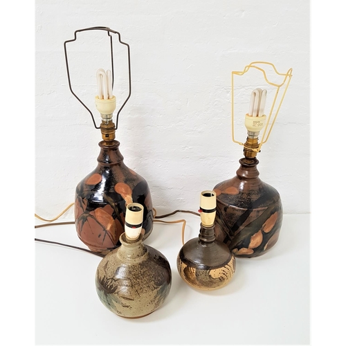 229 - PAIR OF DRYMEN STUDIO POTTERY LAMPS
of bulbous form and decorated with brown, black and green glaze,... 