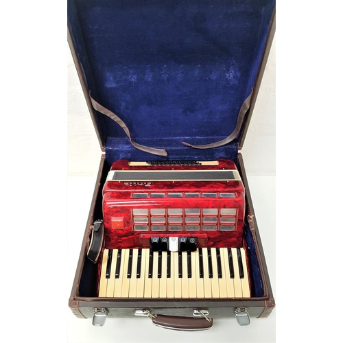 285 - BAILE ACCORDIAN
with a red marbled body and shoulder strap, cased