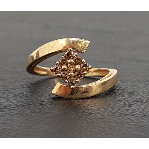 67 - FANCY DIAMOND CLUSTER RING
the nine diamonds in rhomboid shaped setting, on nine carat gold shank wi... 