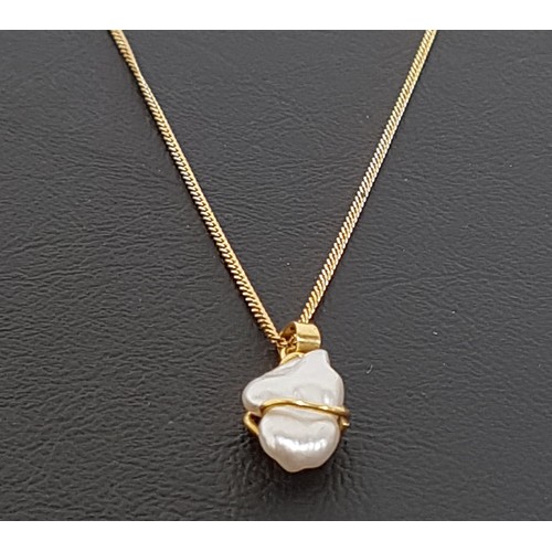 83 - BAROQUE PEARL PENDANT 
in eighteen carat gold mount and on unmarked gold neck chain (clasp lacking)