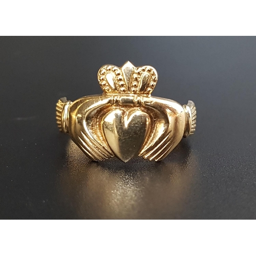 24 - NINE CARAT GOLD CLADDAGH RING
size S-T and approximately 3.9 grams