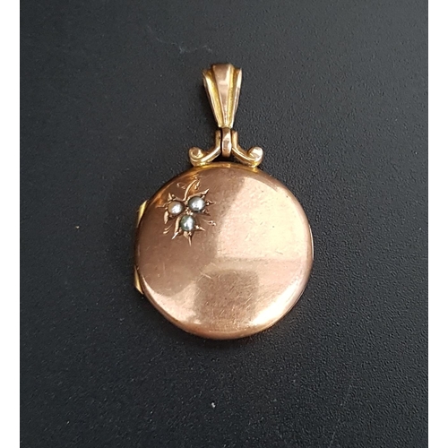 69 - NINE CARAT GOLD LOCKET PENDANT
the circular locket with seed pearl decoration, total weight approxim... 