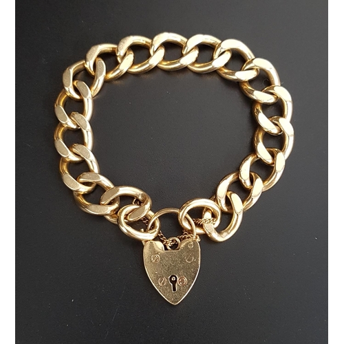 72 - HEAVY NINE CARAT GOLD CURB LINK BRACELET
with nine carat gold heart padlock clasp and safety chain, ... 