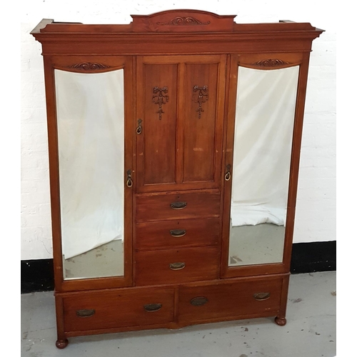 478 - EDWARDIAN MAHOGANY PRINCESS WARDROBE
with an arched and moulded cornice above a central cupboard doo... 