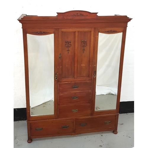 478 - EDWARDIAN MAHOGANY PRINCESS WARDROBE
with an arched and moulded cornice above a central cupboard doo... 