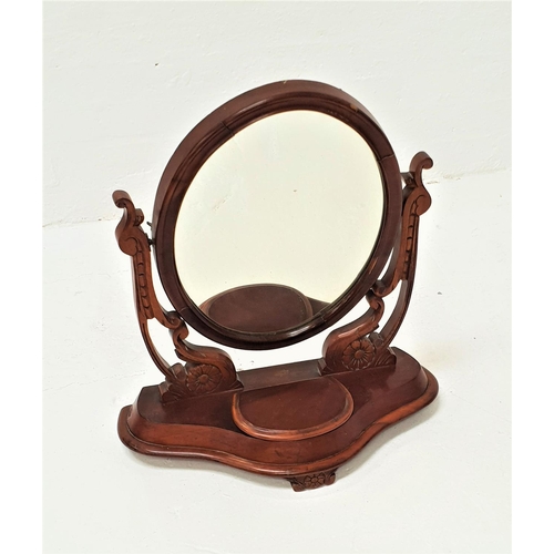 457 - VICTORIAN MAHOGANY DRESSING TABLE MIRROR
with an oval plate on shaped carved supports, above a shape... 