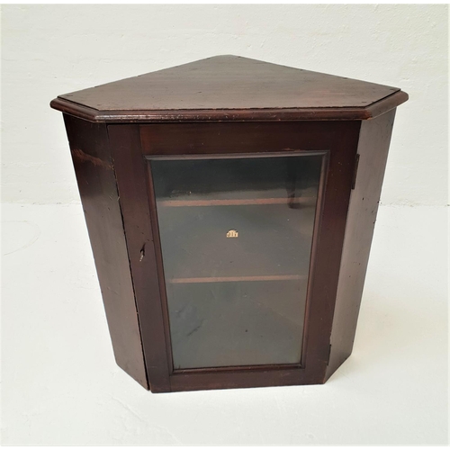 458 - 1940s MAHOGANY CORNER CABINET
with a moulded top above a glass panel door, opening to reveal shelves... 