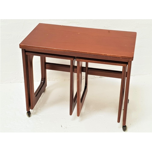 464 - MCINTOSH TEAK OCCASIONAL TABLE
with an oblong fold over rotating top above two pull out occasional t... 