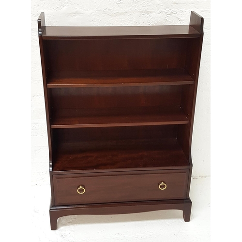 489 - STAG MINSTREL MAHOGANY BOOKCASE
with four shelves, two being adjustable, above a lower panelled draw... 