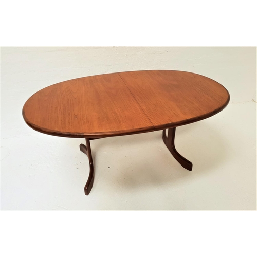 460 - G PLAN TEAK EXTENDING DINNING TABLE
with an oval pull apart top and fold out leaf, standing on twin ... 