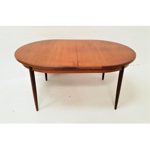 462 - G PLAN TEAK EXTENDING DINING TABLE
with an oval pull apart and fold out leaf, standing on four taper... 