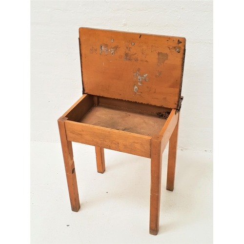 472 - CHILDS BEECH SCHOOL DESK
with a central inkwell recess and pen trough and lift up lid, standing on s... 