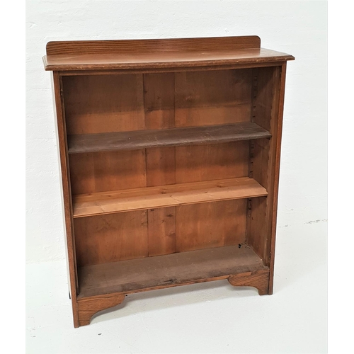 474 - OAK BOOKCASE
with a shaped and raised back above a moulded top with three adjustable shelves below, ... 