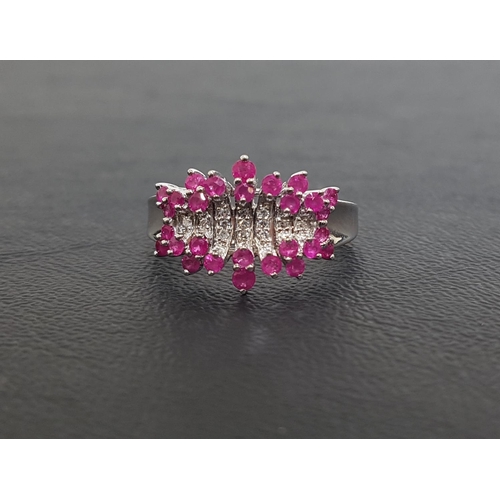 12 - RUBY AND DIAMOND CLUSTER DRESS RING
the multi round cut diamonds with rubies above and below, on nin... 