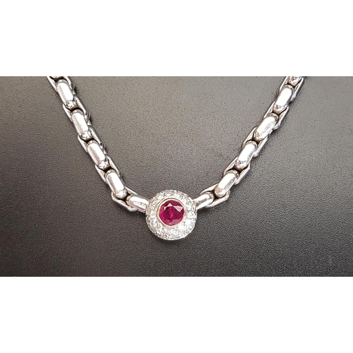 52 - RUBY AND DIAMOND AND NECKLACE
the pendant section with central ruby of approximately 0.56cts in pave... 