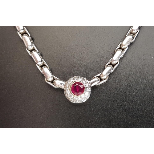 52 - RUBY AND DIAMOND AND NECKLACE
the pendant section with central ruby of approximately 0.56cts in pave... 