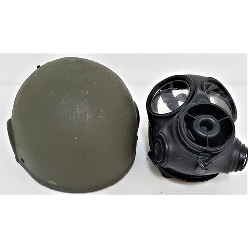 375 - BRITISH MILITARY MK6 COMBAT HELMET
in green, the interior with leather covered foam pads, webbing ch... 