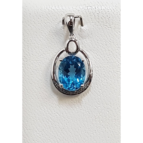 21 - BLUE TOPAZ AND DIAMOND PENDANT
the central oval cut blue topaz approximately 2.5cts with illusion se... 