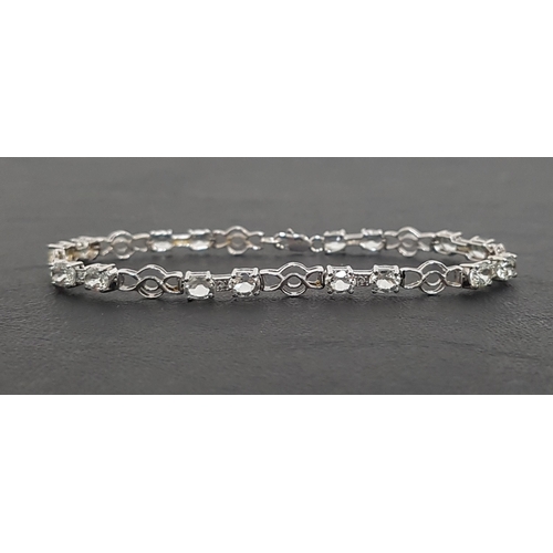 45 - AQUAMARINE AND DIAMOND LINE BRACELET
the oval cut aquamarines separated by small diamonds and pierce... 
